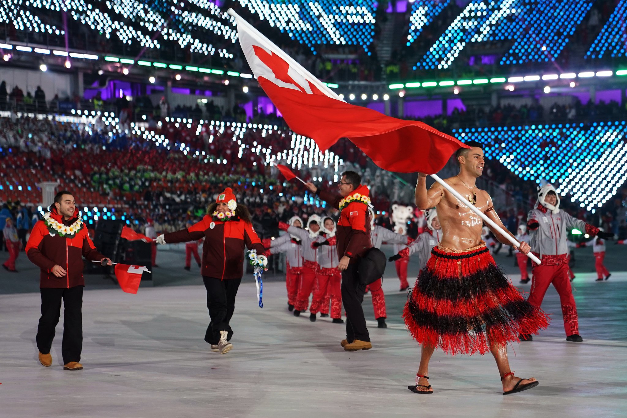 Pita Taufatofua Marched Shirtless with the Flag of Tonga